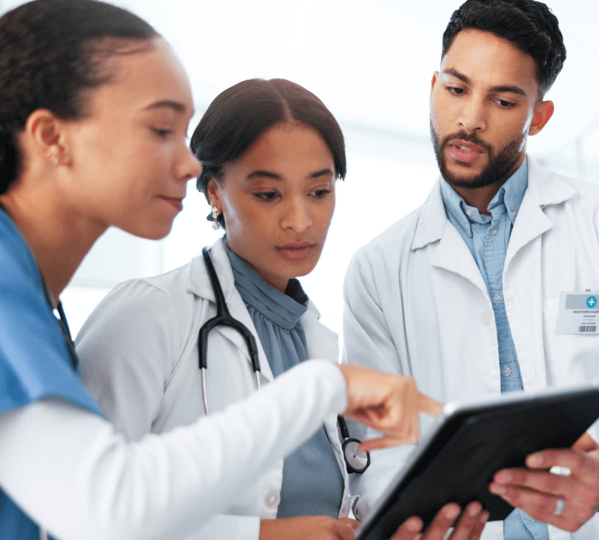 Diverse group of clinicians collaborating in a hospital setting