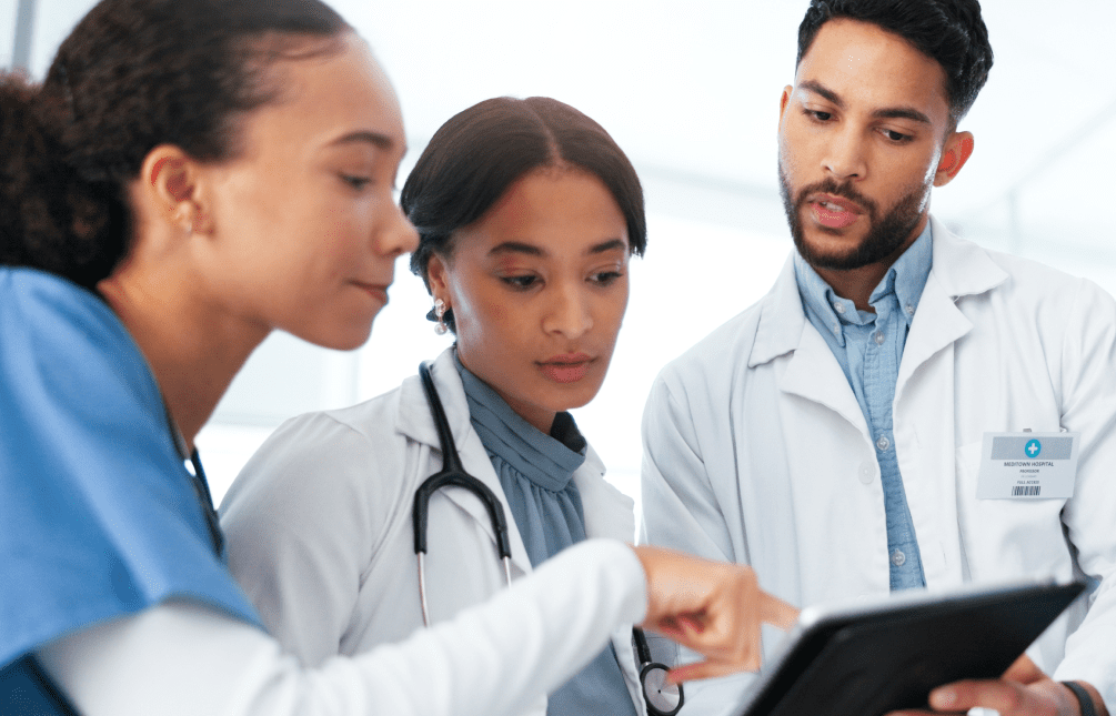 Diverse group of clinicians collaborating in a hospital setting