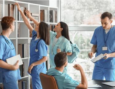 A diverse group of nursing students accessing and using educational resources