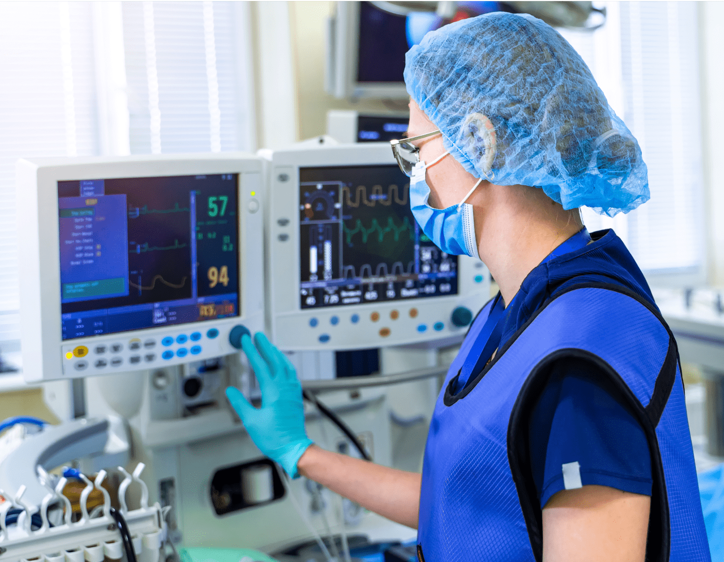 A female nurse working with state-of-the-art patient monitoring equipment