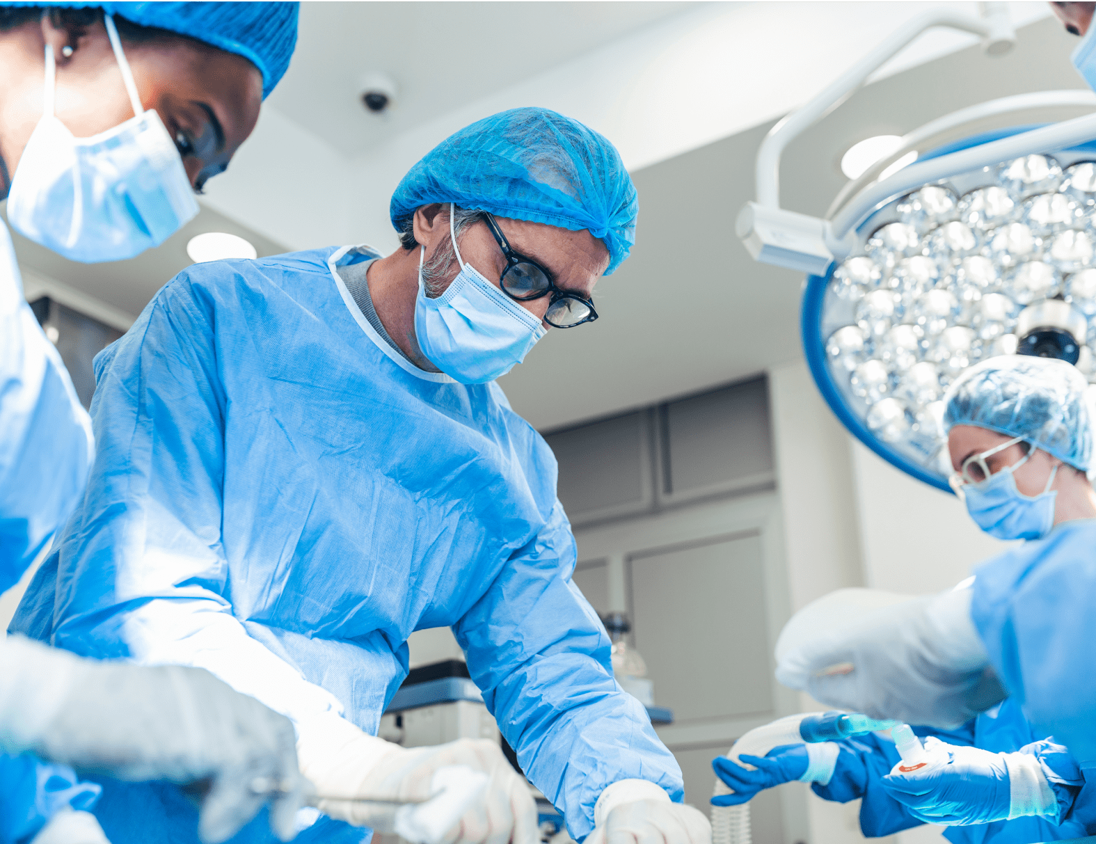 A male nurse assisting during a surgical procedure