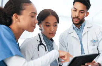 Diverse group of clinicians collaborating in a hospital setting