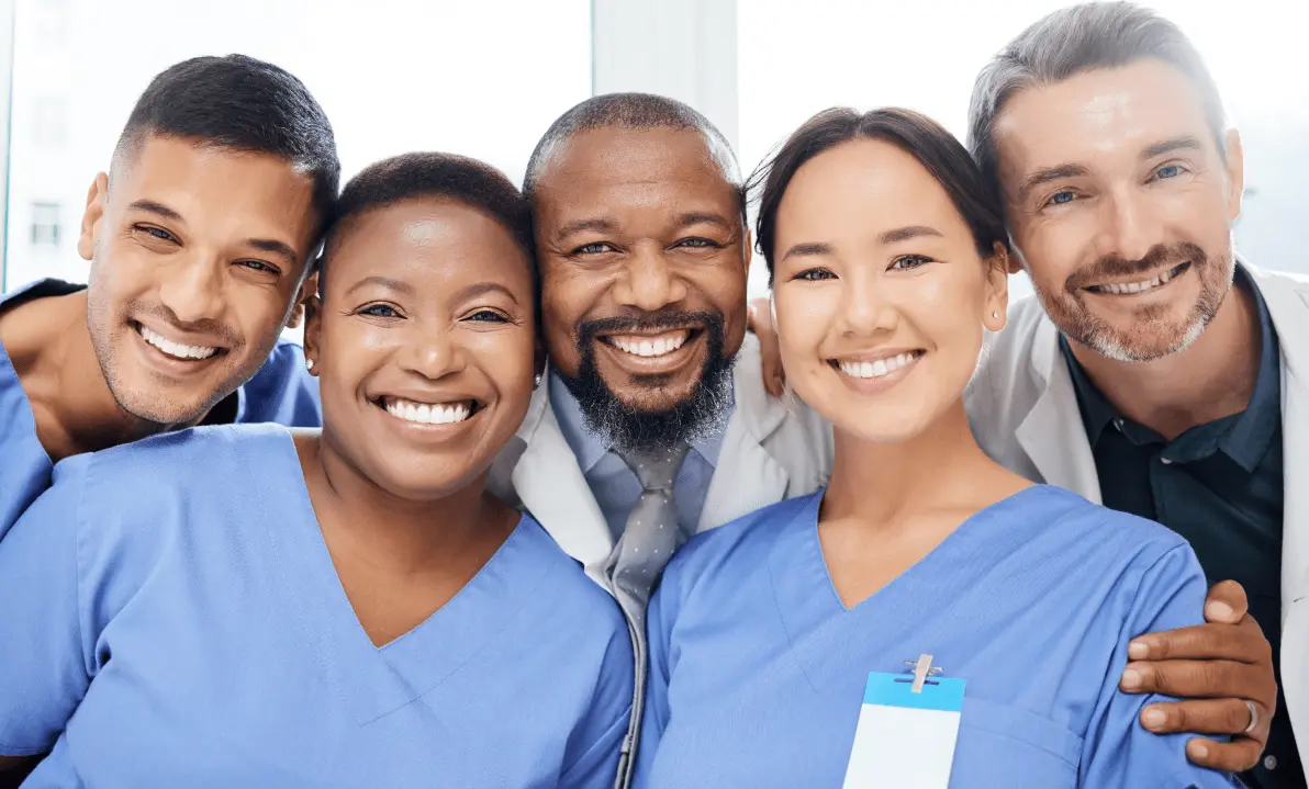 Close-up of a diverse group of smiling clinicians