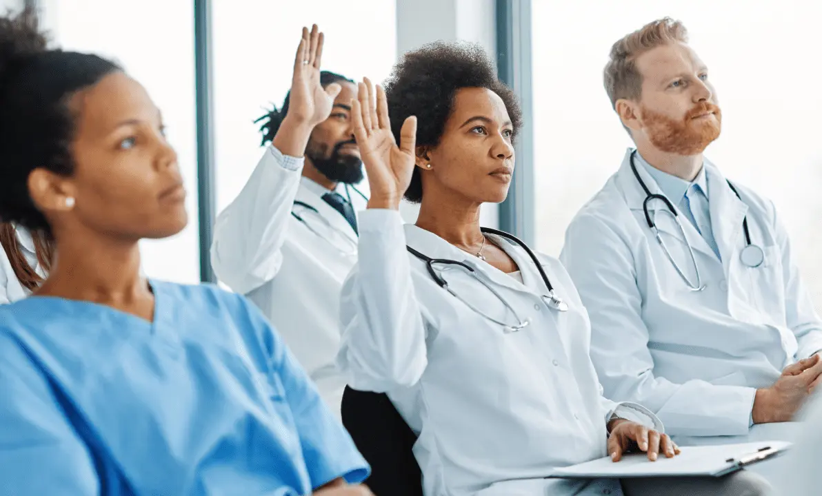 A diverse group of doctors and nurses in a training event